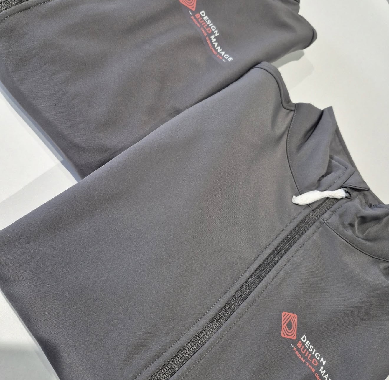 Design Build Manage branded softshell jackets